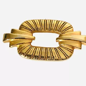"Broche vintage en tono dorado firmado TAT Art Deco 2,25X1,25" - Imagen 1 de 3