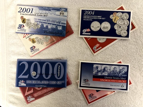 Set of Four (4) Different Uncirculated 2000s U.S. Mint Sets in OGPs w COAs Cover