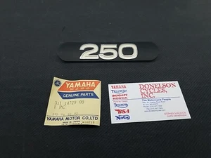 Yamaha N.O.S 311-14729-00-00 Dt 2 Emblem - Picture 1 of 7