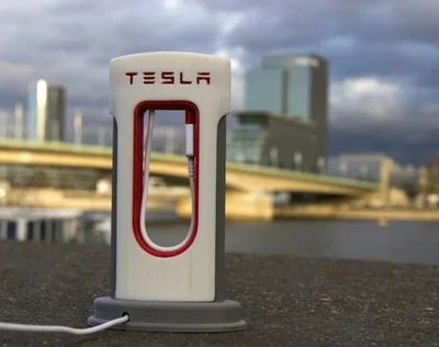 Soporte de cable de carga para teléfono iPhone Android estación de súper cargador Tesla de escritorio Foto 1 de 2