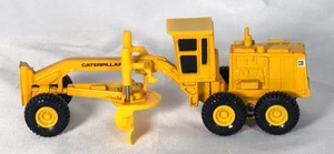 Ertl - Mighty Movers - Motoniveladora Caterpillar CAT - Escala 1:64 - Imagen 1 de 12