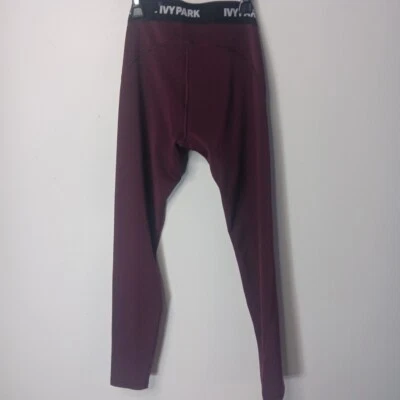 Legging feminina IVY PARK marrom média ajuste apertado cintura baixa bolso interno - Imagem 1 de 4