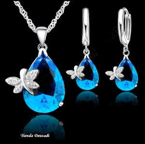 CADENA,COLGANTE Y PENDIENTES DE CRISTAL AZUL CON ALEGRÍAS DE MARIPOSAS - Imagen 1 de 1
