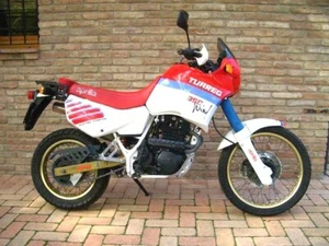 APRILA TUAREG 350 WIND RICAMBI VARI MOTORE CARENE CERCHI FRENI PEDANE ELETTRICO - Foto 1 di 1