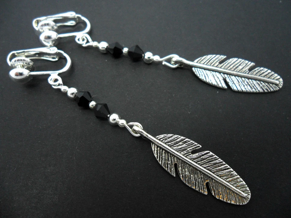 UN PAR DE PENDIENTES CON CLIP LARGO DE PLUMA COLGANTE DE PLATA TIBETANA. NUEVO. Foto 1 de 1