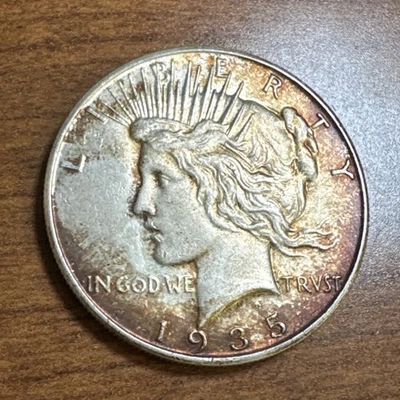 1935 $1 Peace Silver Dollar Uncirculated Reddish Brown Toning - Image 1 of 4