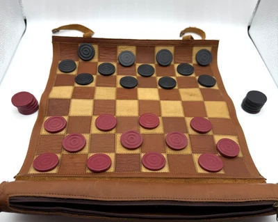 Vintage Leather Roll Up Travel Checkers Or Chess Set Board Stamped Pieces  - Image 1 of 4