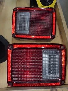 2007-2017 Jeep JK Wrangler Tail Lights OEM Right And Left Plus Fuel Bezel - Picture 1 of 3