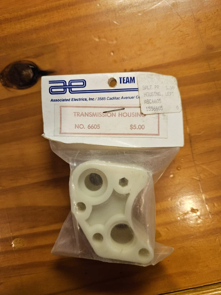 Carcasa de transmisión Team Associated 6605 de colección RC10 RC parte Gold Pan de colección Foto 1 de 1