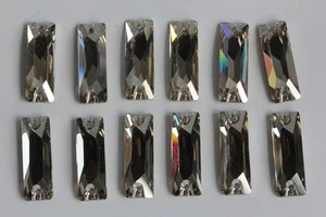 SWAROVSKI 12 x bottoni in vetro 3255 baguette cosmica (59001) - Foto 1 di 5
