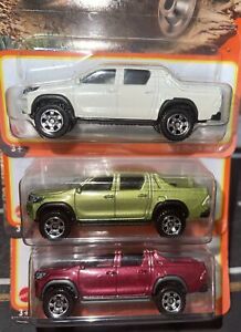 Lot Of 3 Matchbox Toyota Hilux Pickup RED, Green & White Die Cast 1:64 New IP