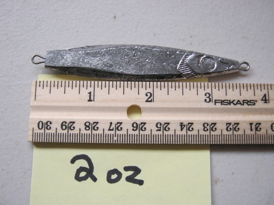 7 - 2 OZ FLUTTER FISHING SPOONS JIGGING CASTING LEAD SLAB  FRESH & SALT WATER. - Image 1 of 1