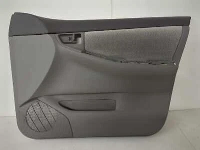 Nuevo panel de moldura de puerta delantera OEM Toyota Corolla 2003-2008 diestro gris tela eléctrica abolladura Foto 1 de 4