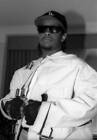 Rapper Eazy-E wears a straightjacket when he appears in a portrai - Old Photo 1
