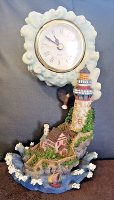 Classic Treasures Collectable Eagle's Swing lighthouse swing clock with eagle  - Image 1 of 2