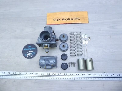 1976 Suzuki GT250 S574-1) Mikuni carburetors carbs parts bowl spring needle cap - Image 1 of 4