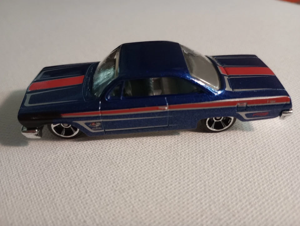 Chevy Impala 2012 Hotwheels Muscle Mania GM '62 azul 5 velocidades ruedas cromadas  Foto 1 de 4