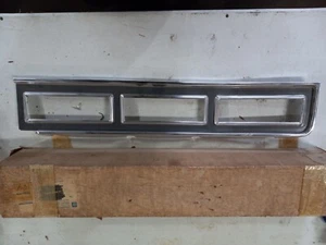 GM NOS 5966763 LH TAIL LIGHT BEZEL. IMPALA 74 75 76 - Picture 1 of 3