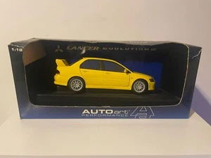 AutoArt Performance Mitsubishi Lancer Evolution VII - Yellow - 1:18 - Picture 1 of 7