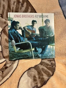 JONAS BROTHERS FLY WITH ME 7" SINGLE BEFORE THE STORM BLUE VINYL JONAS CLUB - Imagen 1 de 2