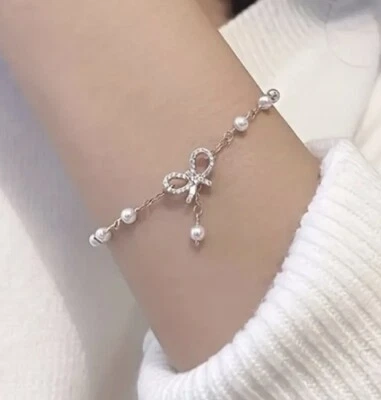 Pulsera con lazo y dije imitación perla cuentas tono dorado regalo moda joyería lazos Foto 1 de 4