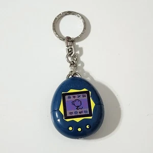 Vintage 1997 Tamagotchi McDonalds Happy Meal Spielzeug blau Schlüsselanhänger Ring - Bild 1 von 3