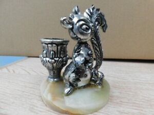 Silver Squirrel and candle holder on marble