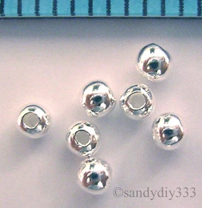 100x HELLE STERLINGSILBER RUNDE NAHTLOSE 2mm SPACER PERLEN KLEINES LOCH (#552) - Bild 1 von 2
