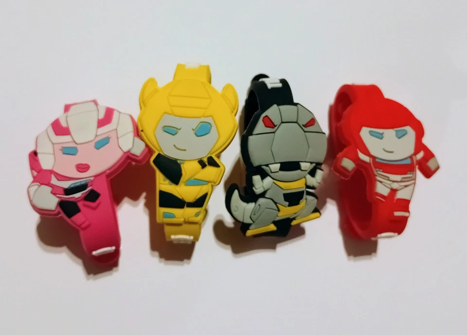 TRANSFORMERS ROBOTS RUBBER BRACELETS SET HASBRO GERMANY MINIATURES COLLECTIBLES - Image 1 of 1