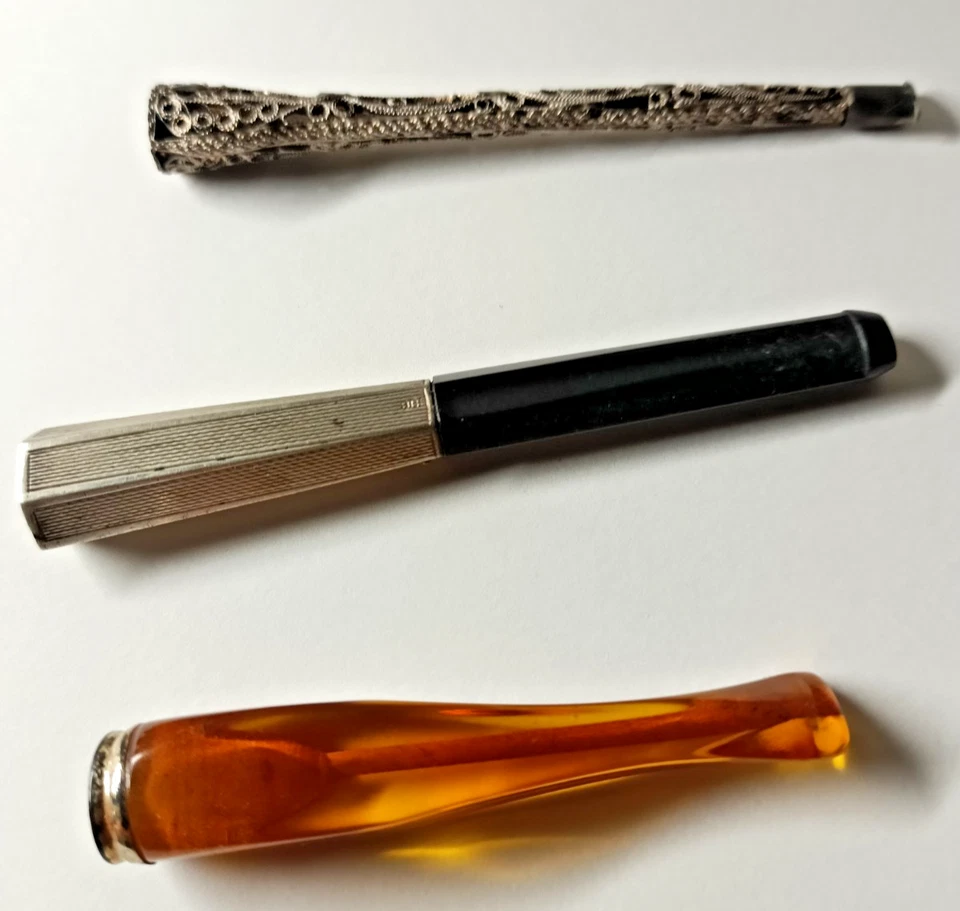 3 Antique Cigarette Holders  Silver Filigree, Amber and Bakelite/w silver Clean - Image 1 of 4