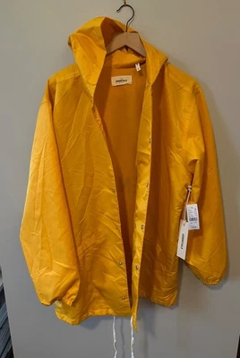 NWT Fear of God Essentials Long Hooded Coaches Jacket Yellow Men's Size Medium - Image 1 of 4