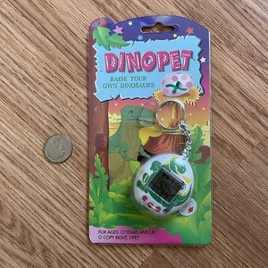 Vintage 1997 Dinopet Virtual Dinosaur Pet Tamagotchi White & Green - Picture 1 of 2