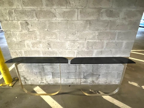 Fabulous 1970's Modernistic Curved Brass and Black Glass Console Tables - A Pair Cover