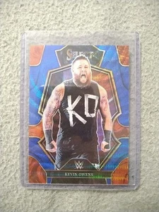 2023 Panini Select WWE - Premier Level Kevin Owens #169 Blue Wave Prizm /99 - Bild 1 von 2