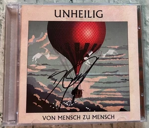 ORIGINAL Autogramm von Unheilig. pers. gesammelt. Auf CD Cover. VON MENSCH ZU M. - Picture 1 of 1
