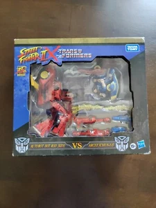 Street Fighter II X Transformers Autobot Hot Rod (Ken) Vs Arcee (Chun-Li) Hasbro - Imagen 1 de 11
