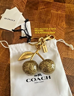 COACH Cereza ORO BRILLO Llavero o Bolso Dije 77840 Auténtico NUEVO CON ETIQUETAS CON BOLSA Foto 1 de 4