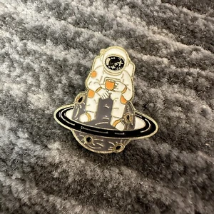 Enamel Pin Astronaut Space Brooch Lapel Backpack Saturn Coffee Sky Rocket Man - Picture 1 of 5