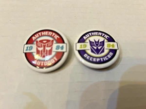 TRANSFORMERS AUTOBOT & DECEPTICON AUTHENTIC LOGO 1984 PIN BUTTON SDCC 2023 - Picture 1 of 2