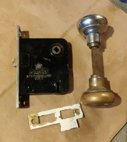 Antique Art Deco door knob with Sargent lock hardware and strike plate Cover