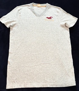 T-shirt vintage Hollister scollo a V taglia XL grigia a righe logo ricamato cotone Y2K - Foto 1 di 8