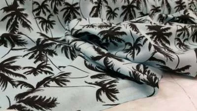 100% Rayon challis black Palm tree on baby blue background - Image 1 of 4