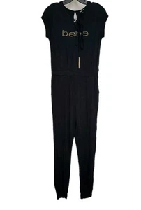 NWT BEBE SIZE L STUDED BEBE LOGO LACE UP JUMPSUIT DETAILED SEXY!! - Picture 1 of 2