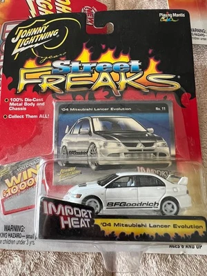 JOHNNY LIGHTNING WHITE LIGHTNING  IMPORT HEAT 2004 MITSUBISHI LANCER EVOLUTION - Image 1 of 4