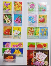 Lotto di 64 francobolli mondiali + confezione Bolaffi tematica fiori