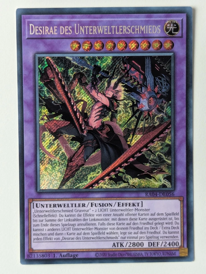 Desirae des Unterweltschmieds RA04-DE056 Secret Rare Deutsch NM YUGIOH - Bild 1 von 1