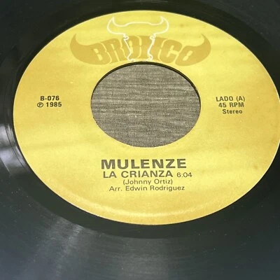 Orquesta Mulenze – Te Damos Las Gracias / la Crianza -(1985) BRONCO 076-45RPM - Image 1 of 4