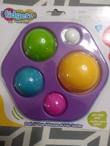 Juguete Fidgetz Push N Pop Edades 3+ Púrpura Inquieto Nuevo - Imagen 1 de 1
