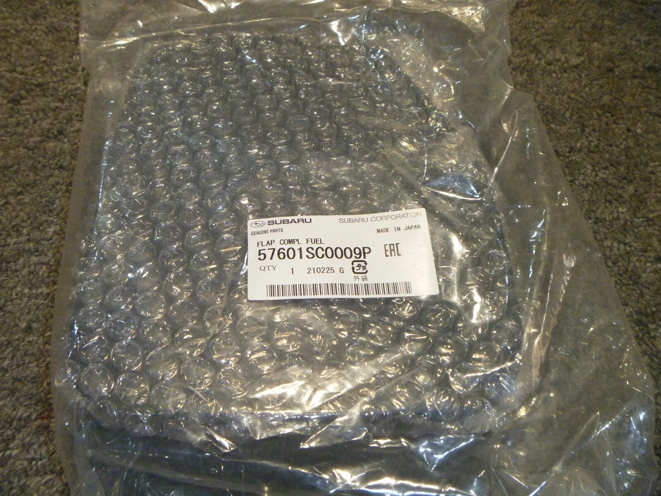 Subaru Forester 2009-2013 puerta de combustible tapa de aleta de gas OEM 57601SC0009P OEM nuevo 2010 Foto 1 de 1