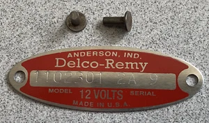 1962 CADILLAC RED DELCO REMY GENERATOR TAG NUMBERED 1102301 & DATED NEW W/RIVETS - Picture 1 of 1
